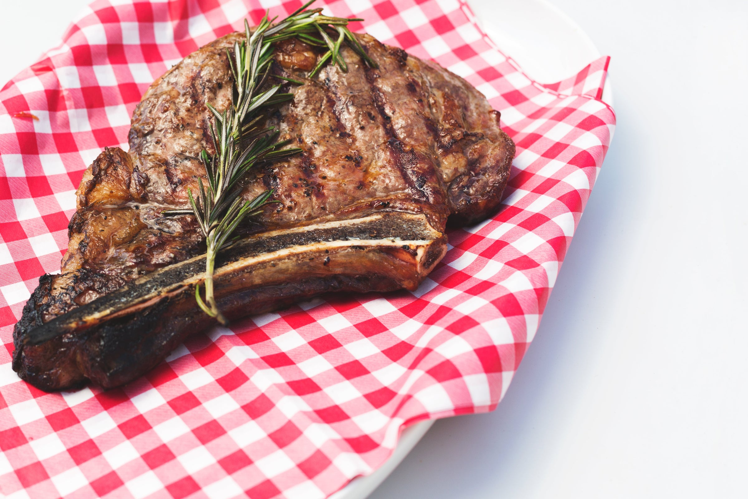 Bone-in steak plated and ready to eat
