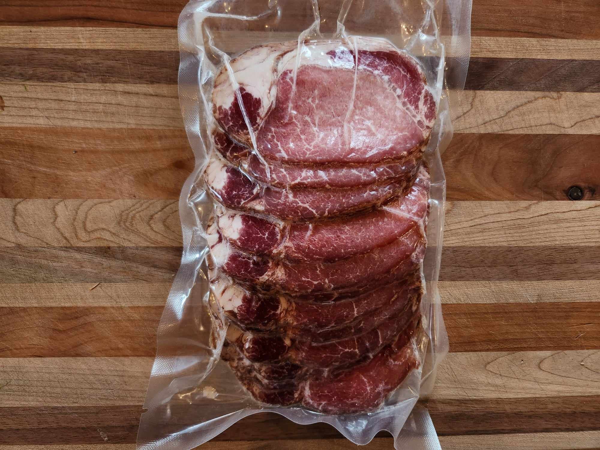 Sliced back bacon from Good Family Farms heritage pork — naturally cured and smoked